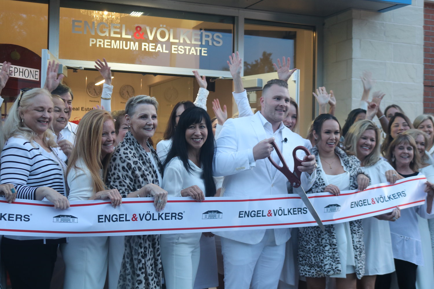 Corey Hasting cuts the ribbon during a ceremony to christen Engel & Volkers’ new Ponte Vedra Beach location Nov. 17.